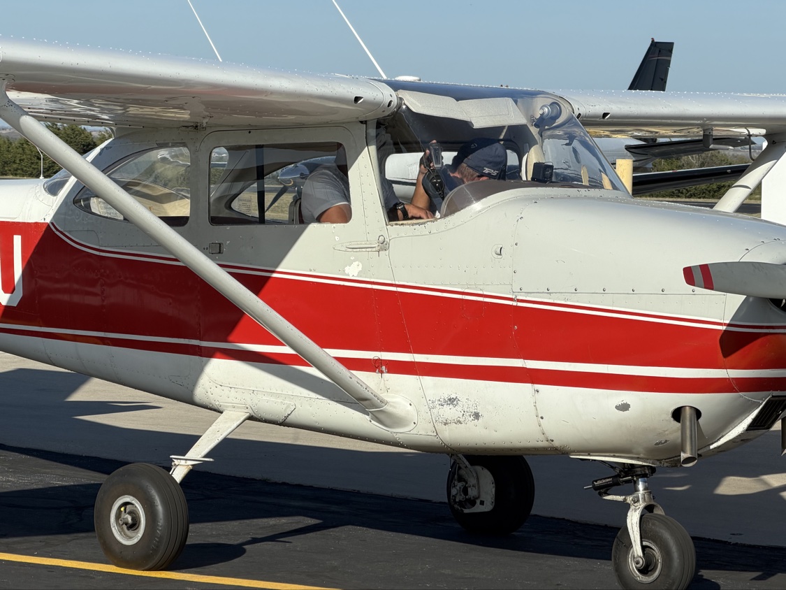 N2666U red and white Cessna 172 on the ramp